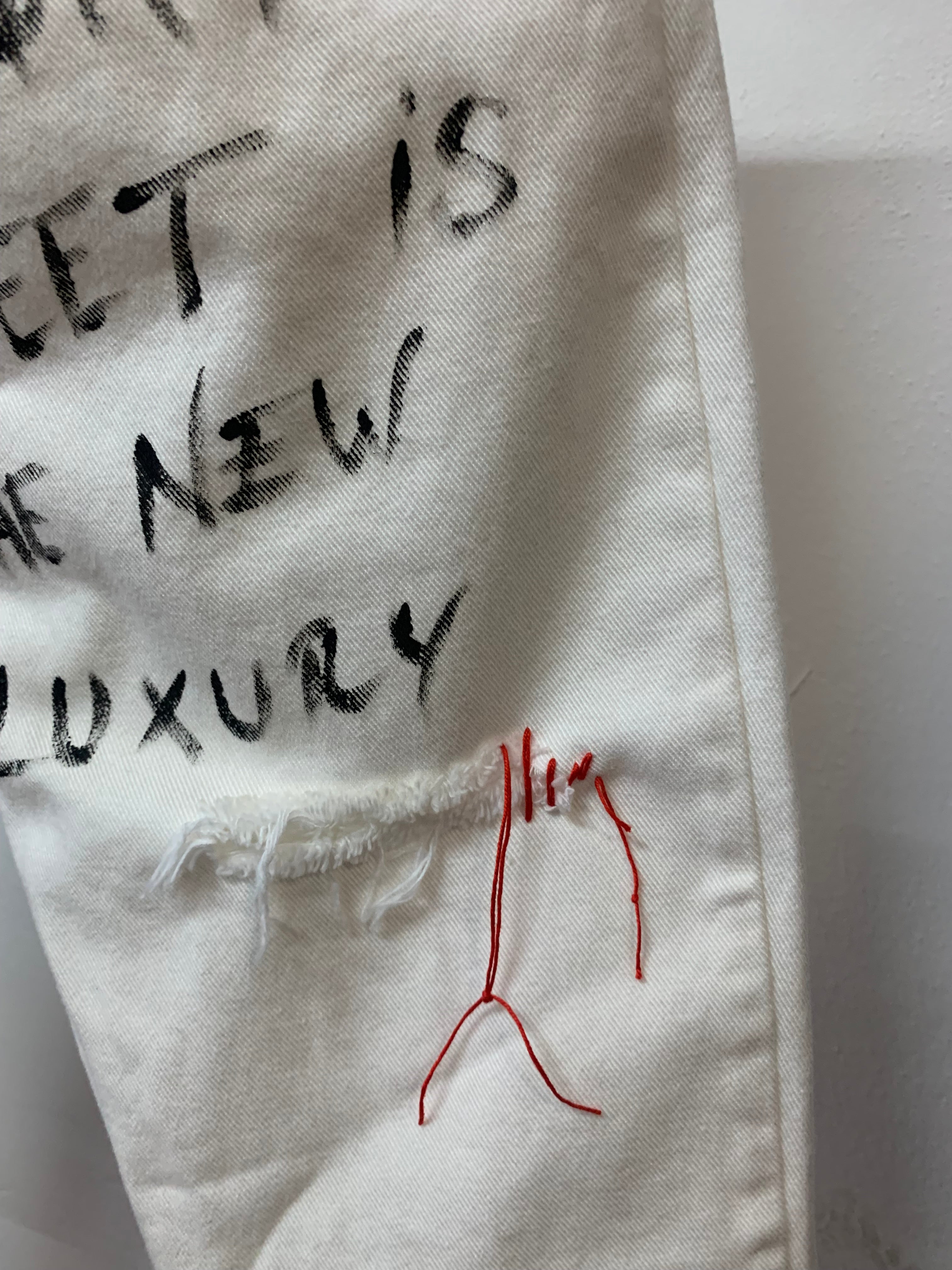 handwritten grapic artwork white jeans